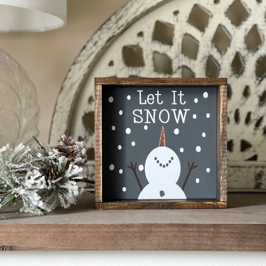 Let it snow snowman sign in dark gray. Christmas decor and winter decor.
